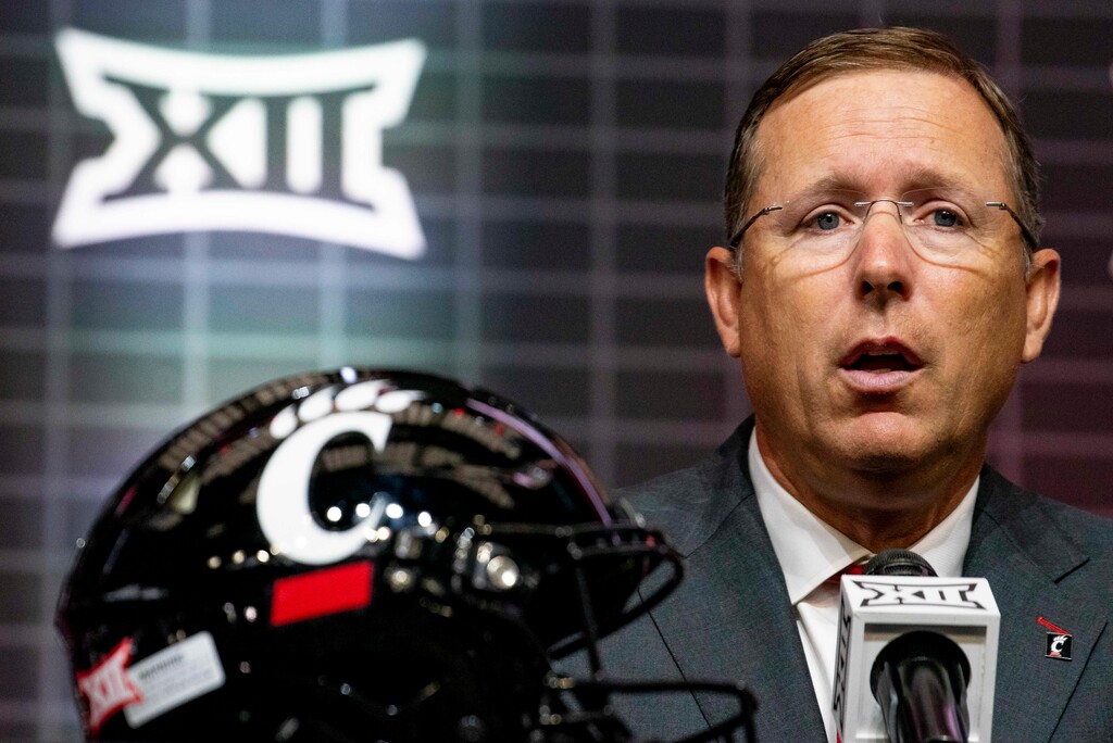 (Emil T. Lippe | AP )Cincinnati head football coach Scott Satterfield answers questions from reporters at Big 12 media days in 2023.