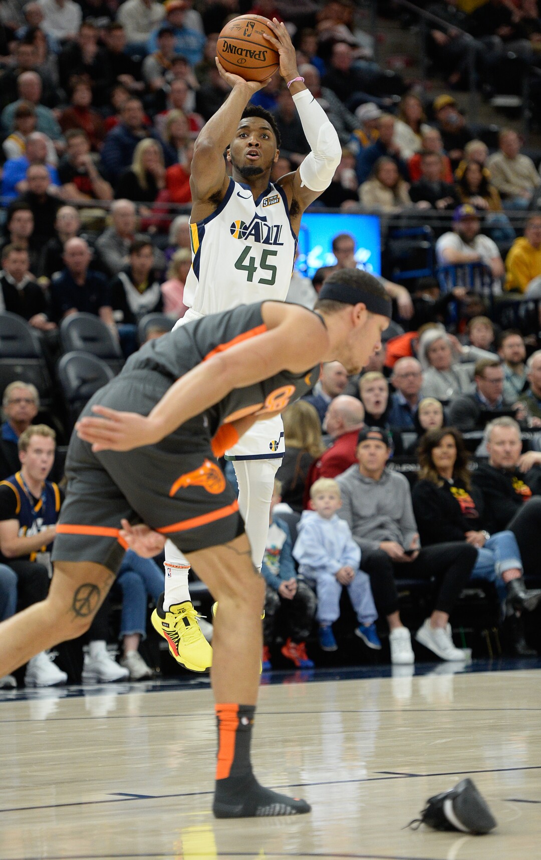 (Francisco Kjolseth  |  The Salt Lake Tribune) Orlando Magic forward Aaron Gordon (00) loses his shoe as Utah Jazz guard Donovan Mitchell (45) gets ready to shoot over him as the Utah Jazz host the Orlando Magic in their NBA basketball game at Vivint Smart Home Arena in Salt Lake City on Tuesday. Dec. 17, 2019.
