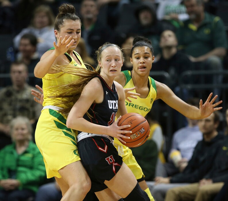 Oregon's Erin Boley, left, and Satou Sabally, right, pressure Utah's Dru Gylten during the first quarter of an NCAA college basketball game Friday, Feb. 1, 2019, in Eugene, Ore. (AP Photo/Chris Pietsch)