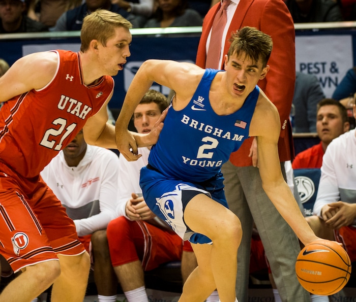 (Rick Egan  |  The Salt Lake Tribune) Brigham Young Cougars guard Zac Seljaas (2) takes the ball inside, as Utah Utes forward Tyler Rawson (21) defends,  in basketball action Utah Utes vs. Brigham Young Cougars at the Marriott Center in Provo, Saturday, December 15, 2017.


