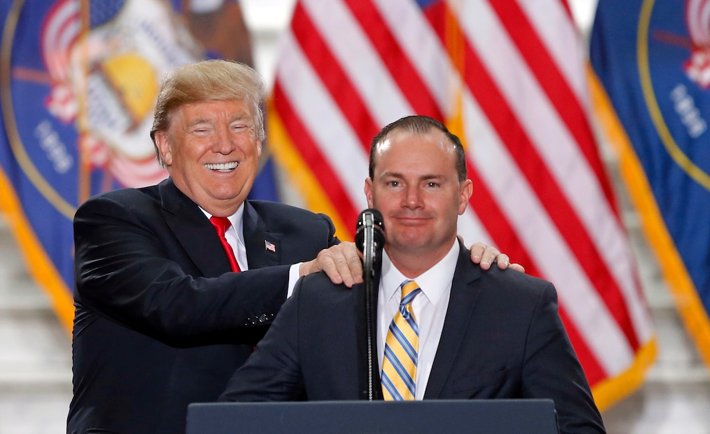 FILE - President Donald Trump stands with Sen. Mike Lee, R-Utah, on Dec. 4, 2017, at the Utah State Capitol. Romney announced earlier this month he won't seek a second term, saying younger people needed to step forward. In so doing, he threw open a wider door for those seeking to enter the race and led to speculation about whether Utah voters will choose a politically moderate successor similar to him or a farther-right figure such as Utah's other U.S. senator, Mike Lee, a Trump supporter. (AP Photo/Rick Bowmer, File)