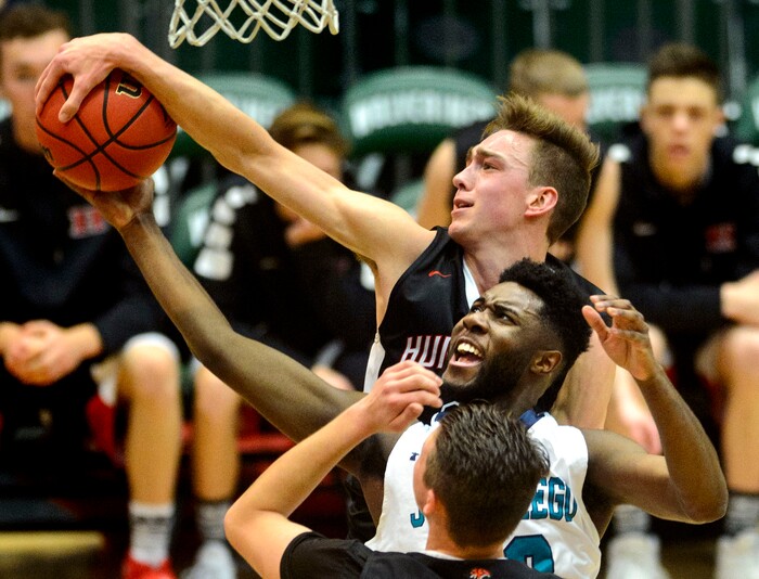 (Steve Griffin | The Salt Lake Tribune) Hurricane's Jackson Last (3) blocks the shot of Juan Diego's Jason Ricketts (23) during 4A basketball playoff game at the Utah Valley UniversityÕs UCCU Center in Provo Thursday March 1, 2018.
