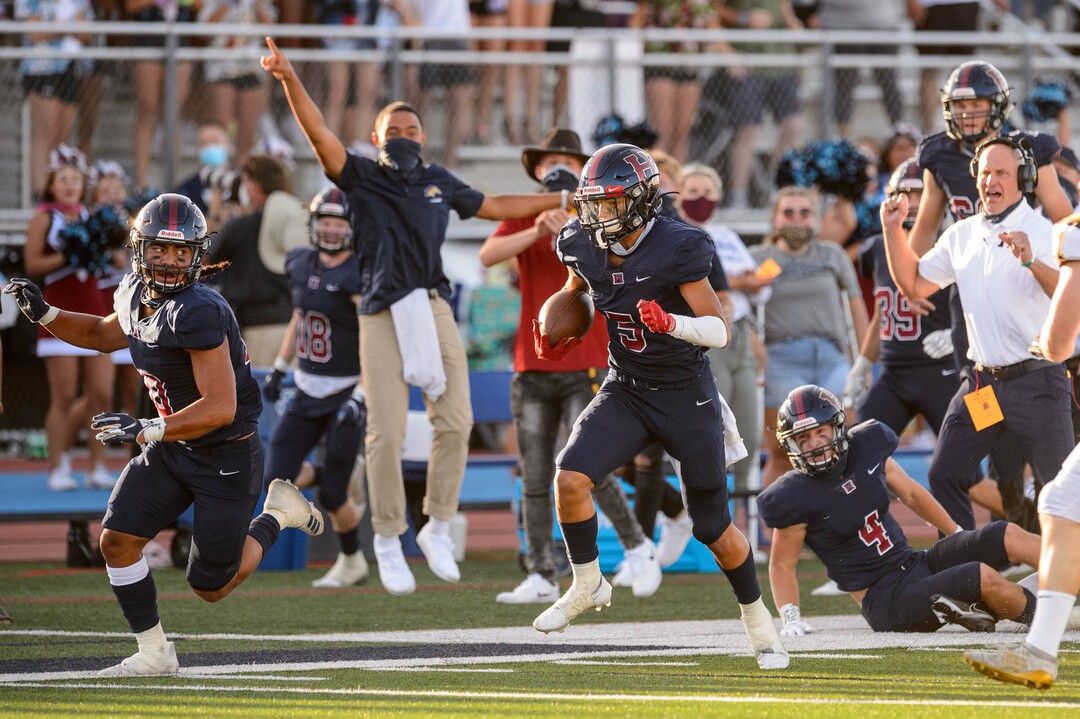 (Trent Nelson  |  The Salt Lake Tribune) Herriman's Brock Hollingsworth runs the ball as Herriman hosts Davis High School football, in Herriman on Thursday, Aug. 13, 2020.
