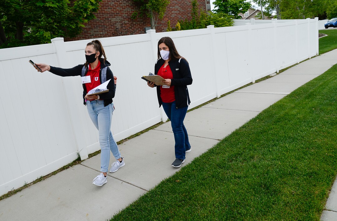 (Francisco Kjolseth  |  The Salt Lake Tribune) University of Utah students Baylee Tollerud, left, and Raquel Bucio, visit randomly selected households in Herriman on Thursday, May 4, 2020, to explain the Utah Health & Economic Recovery Outreach program in hopes of finding people willing to be tested for COVID-19, to find out how widespread the disease actually is in the state. Educators and business leaders are hoping the HERO program, where college-age volunteers are now randomly finding residents to be tested for COVID-19, will blossom into something bigger. They are proposing to expand it into what will be called Hope Corps, with hundreds of students and other volunteers offering hands-on advice and resources to restaurants and retailers who's businesses are struggling in the pandemic.
