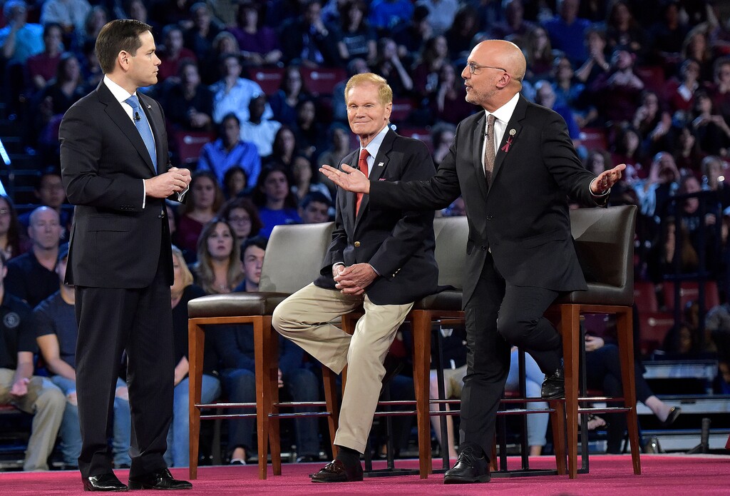 Democratic Rep. Ted Deutch of Florida, right, disagrees with Sen. Marco Rubio during a CNN town hall meeting, Wednesday, Feb/ 21, 2018, at the BB&T Center, in Sunrise, Fla. (Michael Laughlin/South Florida Sun-Sentinel via AP)