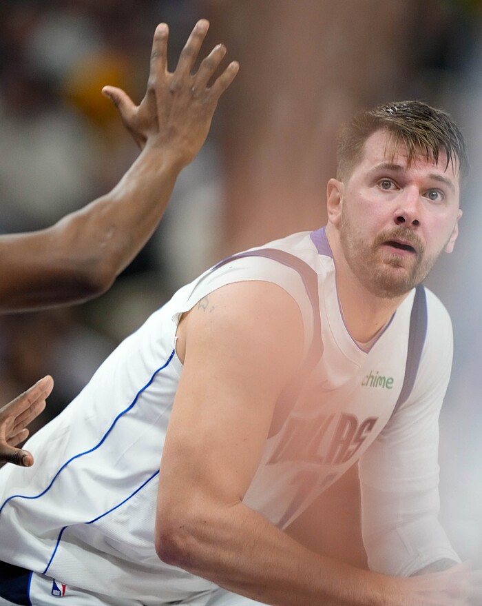 (Francisco Kjolseth  |  The Salt Lake Tribune) Dallas Mavericks guard Luka Doncic (77) looks for an open teammate against the Utah Jazz during an NBA basketball game Monday, March 25, 2024, in Salt Lake City.