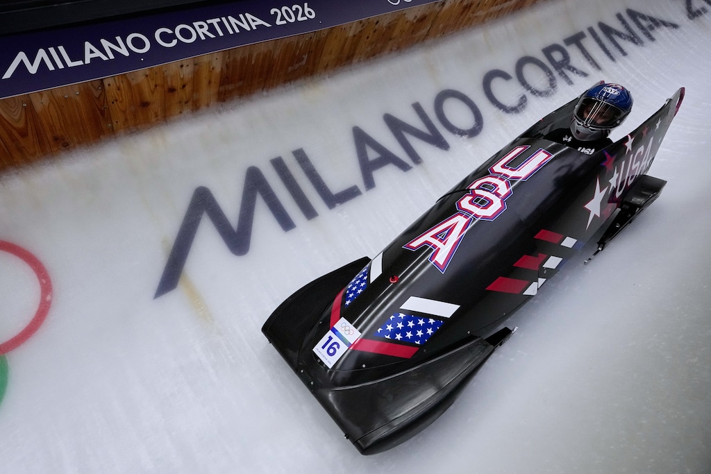 (Aijaz Rahi | AP) United States' Kaysha Love slides down the track during a women's monobob training session at the 2026 Winter Olympics, in Cortina d'Ampezzo, Italy, Thursday, Feb. 12, 2026.