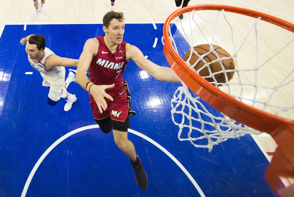 Miami Heat's Goran Dragic, right, of Slovenia, shoots as he gets past Philadelphia 76ers' Dario Saric, left, of Croatia, during the second half in Game 5 of a first-round NBA basketball playoff series, Tuesday, April 24, 2018, in Philadelphia. The 76ers won 104-91. (AP Photo/Chris Szagola)