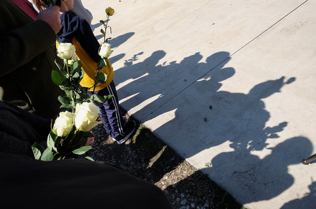 (Francisco Kjolseth  |  The Salt Lake Tribune)  People line up with flowers outside of the Al Sahaba Mosque in Orem to show love and support for the Muslim community following Friday preyer services after the tragic Muslim shootings in New Zealand. 