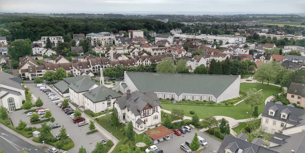(Michael Stack | Special to The Tribune Frankfurt Temple from above. The building in the left lower corner is a historic-style German timber frame in Friedrichsdorf, Germany, on May 16, 2024.