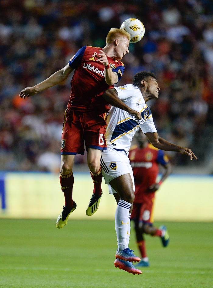 (Francisco Kjolseth  |  The Salt Lake Tribune)  Real Salt Lake defender Justen Glad (15) goes up against Los Angeles Galaxy forward Ola Kamara (11) during the first half of the MLS soccer match Saturday, Sept. 1, 2018, in Sandy at Rio Tinto Stadium.