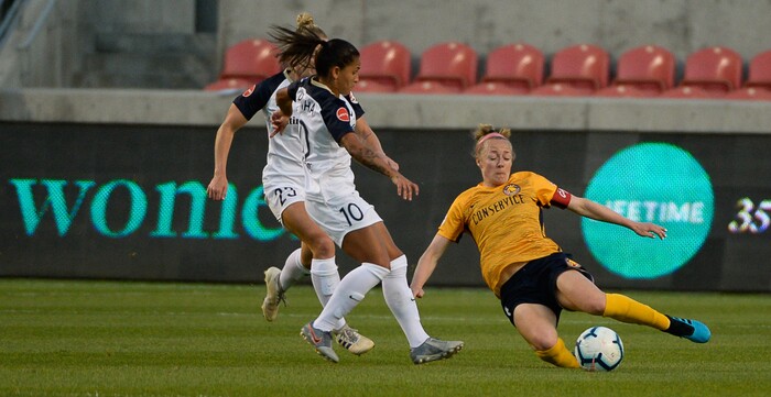 (Francisco Kjolseth  |  The Salt Lake Tribune)  Utah Royals FC defender Becky Sauerbrunn (4) slides in for block on gaol as Utah Royals FC hosts the North Carolina Courage at Rio Tinto Stadium in Sandy, Utah on Saturday, July 27, 2019.