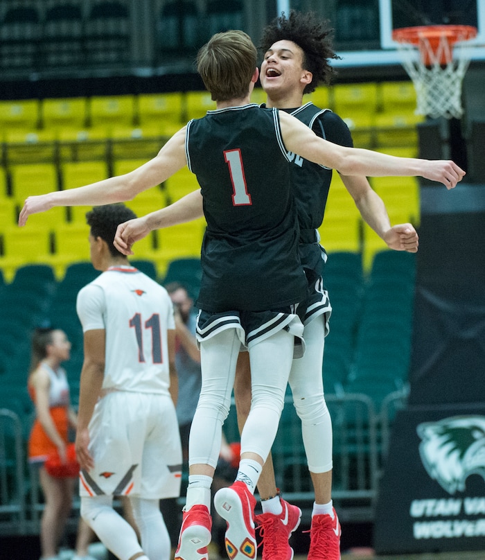 (Rick Egan  |  The Salt Lake Tribune)   Bountiful Braves Cole Knudsen (1) and  Isaac Kime (0) celebrate the Braves win over the Falcons, in 5A basketball playoff action between the Bountiful Braves and Skyridge Falcons, at the UCCU Center in Orem, Monday, Feb. 26, 2018.