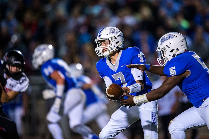 (Chris Detrick  |  The Salt Lake Tribune)  Fremont's Dawson Sanford (7) hands off to Fremont's Jay Scott (5) during the game at Fremont High School Thursday, October 5, 2017. 