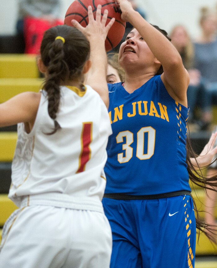 (Rick Egan  |  The Salt Lake Tribune)   San Juan guard Lyandra Benn (30) takes a shot, as Emily Garcia (1) defends, for Judge Memorial, in 3A Women's basketball State playoff action Judge Memorial Vs. San Juan, in Heber City, Friday, Feb. 16, 2018.