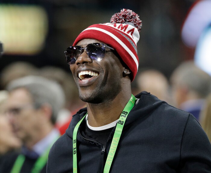 Terrell Owens smiles before the NCAA college football playoff championship game between Georgia and Alabama, Monday, Jan. 8, 2018, in Atlanta. (AP Photo/David J. Phillip)