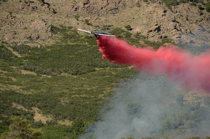 (Francisco Kjolseth  |  The Salt Lake Tribune) Fire crews battle a fire near Millcreek Canyon, on Saturday, July 11, 2020, started near 3400 South Crestwood Dr., as helicopters, single engine air tankers and multiple crews respond.