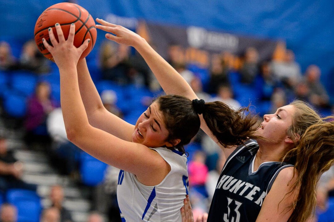 (Trent Nelson | The Salt Lake Tribune)  Fremont's Abby Broadbent (12) and Hunter's Elyse Farley (33) as Hunter faces Fremont in the 6A High School Girls' Basketball Tournament at SLCC in Taylorsville, Tuesday Feb. 20, 2018.