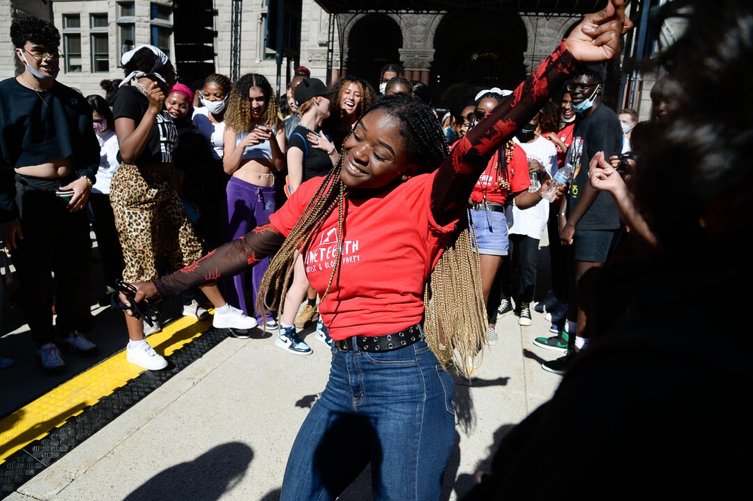 (Francisco Kjolseth  |  The Salt Lake Tribune) Diane Bahati, center, joins revelers dancing during the Juneteenth celebration at Washington Square in Salt Lake City on Friday, June 19, 2020.