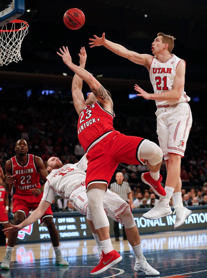 Utah forward David Collette (13) draws an offensive foul on Western Kentucky forward Justin Johnson (23) as Utah forward Tyler Rawson (21) helps defend during the second half of an NCAA college basketball game during the semifinals of the NIT, Tuesday, March 27, 2018, in New York. Utah won 69-64. (AP Photo/Julie Jacobson)