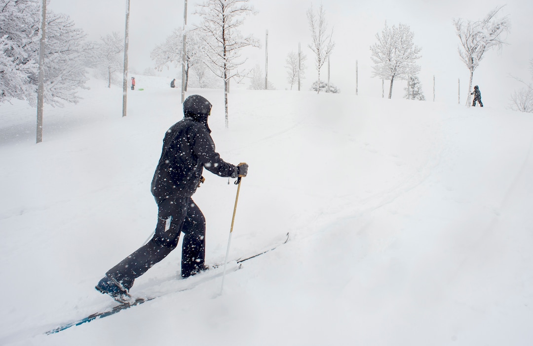(Rick Egan  |  The Salt Lake Tribune)      Randy Brown and 5-year-old Asher take advantage of the new snow to ski at Popperton Park, Monday, Jan. 21, 2019.