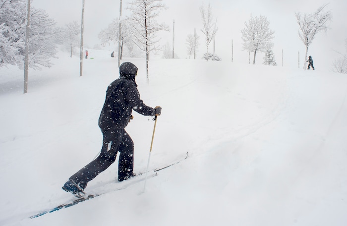 (Rick Egan  |  The Salt Lake Tribune)      
Randy Brown and 5-year-old Asher take advantage of the new snow to ski at Popperton Park, Monday, Jan. 21, 2019.


