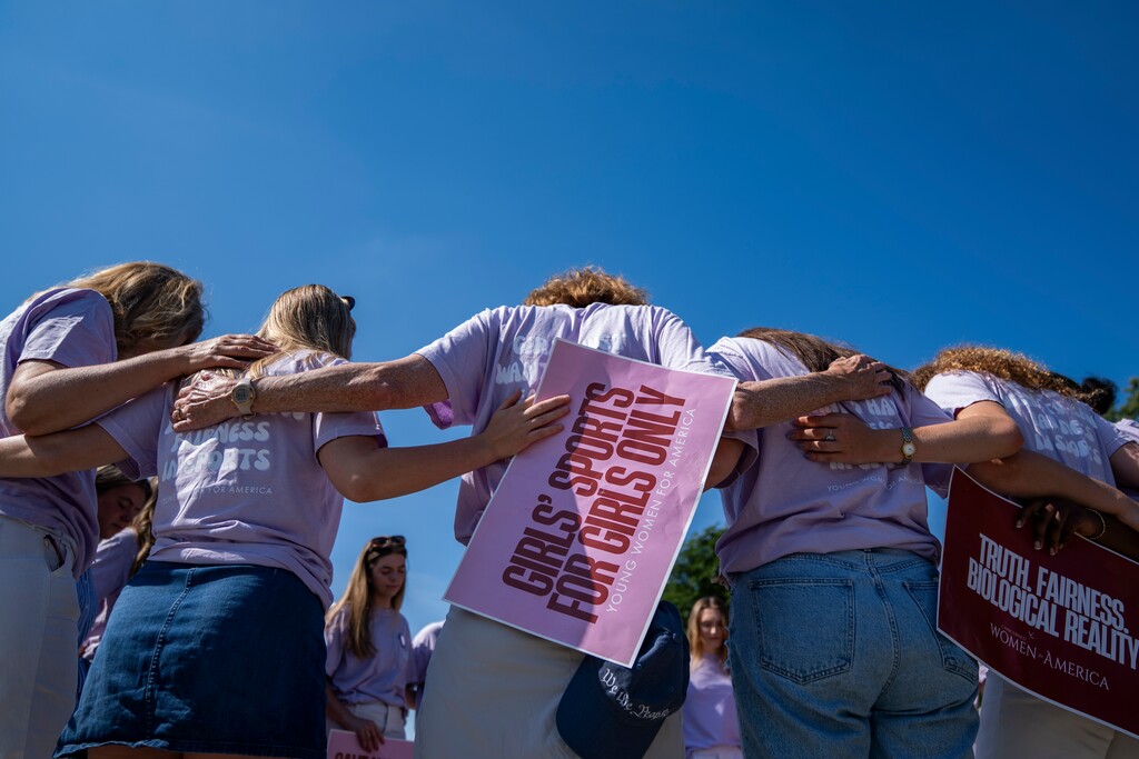 (Allison Robbert | The New York Times) Members of Concerned Women for America pray ahead of decisions outside of the Supreme Court in Washington, on Tuesday, June 30, 2026. The Supreme Court on Tuesday upheld two state laws barring the participation of transgender female athletes from girls’ and women’s sports teams. The court’s ruling deals with laws from West Virginia and Idaho but has implications for the 25 other states with similar restrictions, and for athletes who compete in school and collegiate sports nationwide.