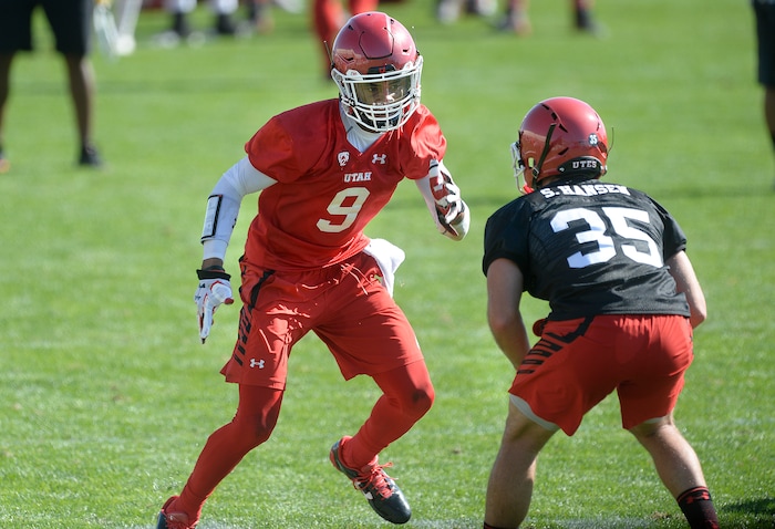 Scott Sommerdorf | The Salt Lake Tribune
WR Darren Carrington II jukes DB Shawn Hansen during the first day of Utah fall football camp, Friday, July 28, 2017.