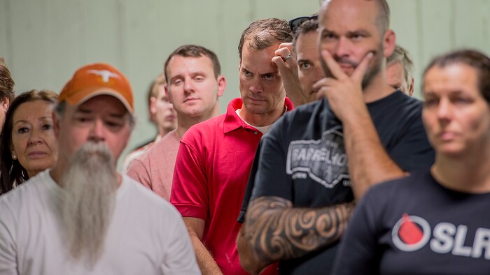 (Leah Hogsten  |  The Salt Lake Tribune) Uintah Fire evacuees listen as Weber County commissioners and the Weber County deputy fire marshal field questions during a press conference at the Dee Events Center on the Weber State University campus in Ogden. Evacuees were given food and water as residents waited to hear if they could return to their homes. The Uintah Fire is still burning through the town of Uintah and pockets of South Weber, as well as the unincorporated subdivision of Uintah Highlands.

