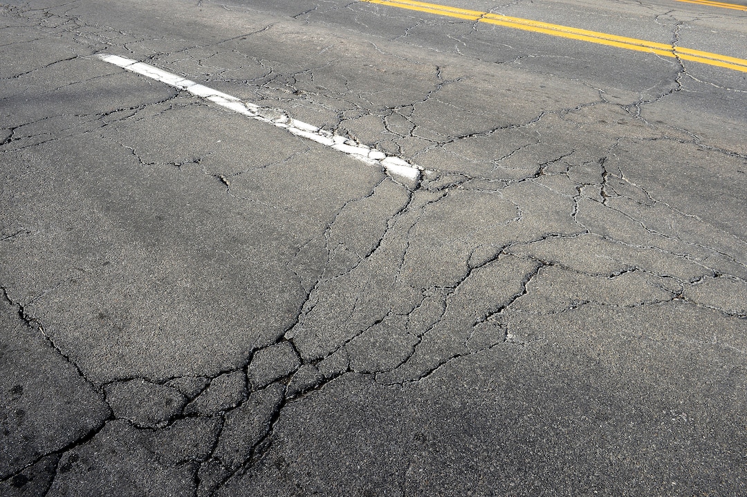 (Scott Sommerdorf   |  The Salt Lake Tribune)   
A section of the damaged road on the south side of 100 South just west of University in Salt Lake City, Wednesday, January 24, 2018.