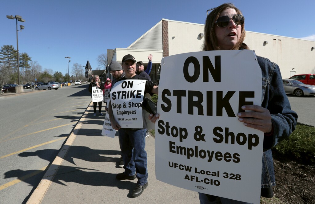 (Charles Krupa | AP file photo)  Union workers picket outside a Stop & Shop supermarket, Thursday, April 11, 2019, in Norwell, Mass., after workers walked off the job in Massachusetts, Rhode Island and Connecticut over stalled contract negotiations.