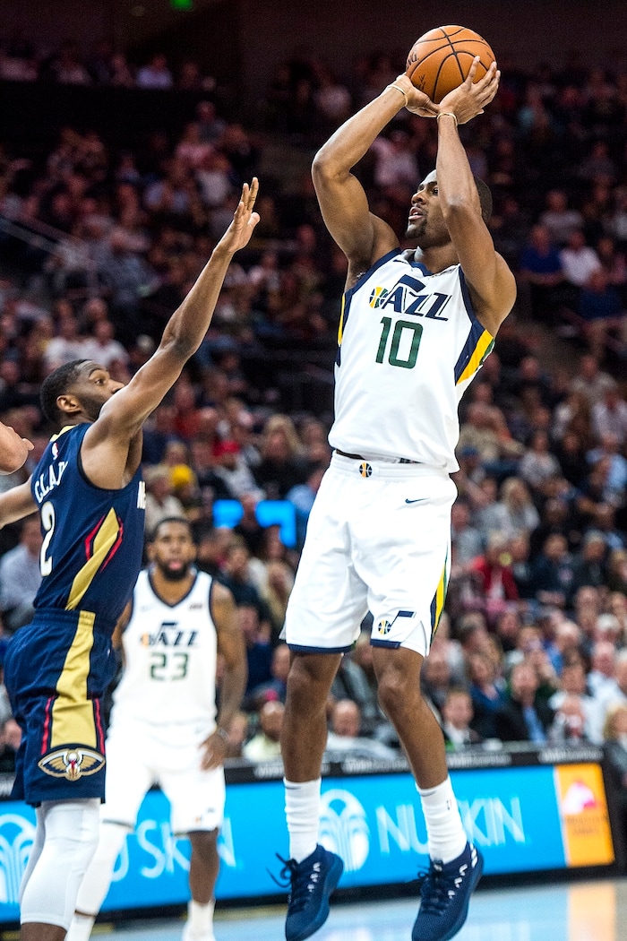 (Chris Detrick  |  The Salt Lake Tribune)  Utah Jazz guard Alec Burks (10) shoots past New Orleans Pelicans guard Ian Clark (2) during the game at Vivint Smart Home Arena Friday, December 1, 2017.  