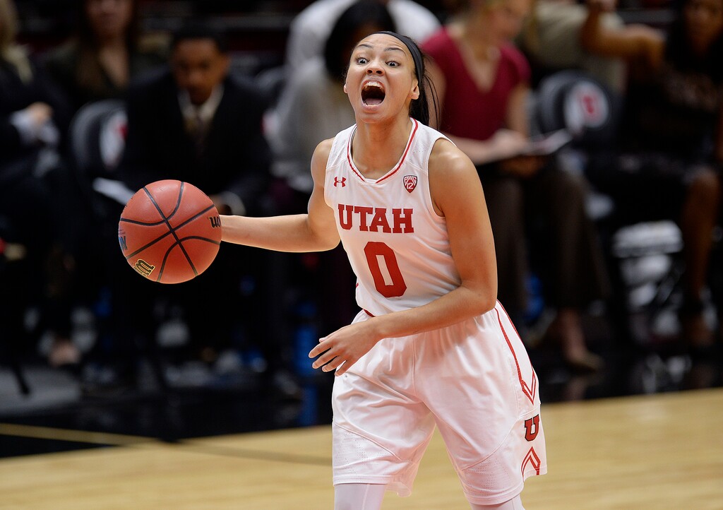 Scott Sommerdorf   |  The Salt Lake Tribune  Utah Utes guard Kiana Moore (0) yells out a play as she brings up the ball during first half play. Utah beat Cal 63-57, Sunday, January 15, 2017. 