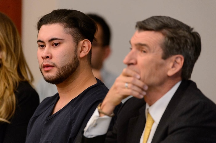 (Trent Nelson | The Salt Lake Tribune)  Abraham Miranda listens to statements from victims and their families at his sentencing in Salt Lake City, Thursday December 21, 2017. Miranda, 19, pleaded guilty to manslaughter counts for a February crash that killed two of his West High School classmates and critically injured a pregnant woman and her baby. At right is Miranda's attorney Greg Skordas.