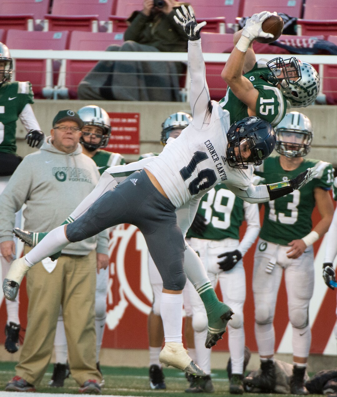 (Rick Egan  |  The Salt Lake Tribune)    Olympus receiver Noah Bennee hauls in a pass, as Corner Canyon defensive back Austin Bell (10) defends, for the Chargers, in 5A football semifinal action between Olympus and Corner Canyon at Rice-Eccles Stadium, Thursday, Nov. 8, 2018.