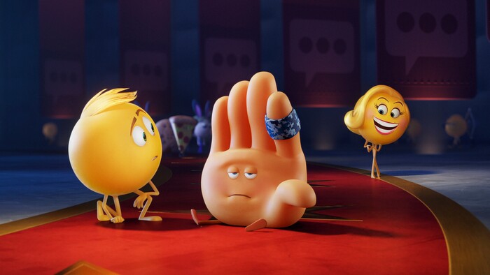 This image released by Sony Pictures shows characters, from left, Gene, voiced by T.J. Miller, Hi-5, voiced by James Corden and  Smiler, voiced by Maya Rudolph  in Columbia Pictures and Sony Pictures Animation's "The Emoji Movie." (Sony Pictures Animation via AP)