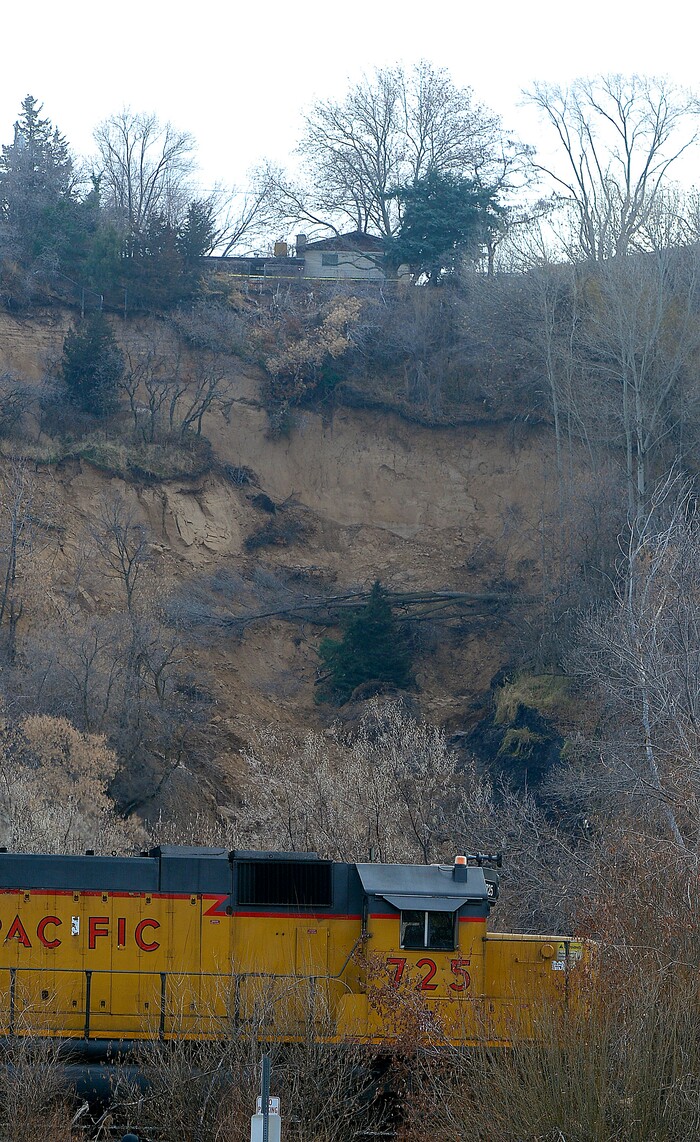 (Al Hartmann | The Salt Lake Tribune)
Unstable slope beneath house near 4860 S. 600 W. in Riverdale Wednesday Nov. 29. Four houses in a row whose backyard's facing west, with railroad tracks and the Weber River Parkway below have been evacuated due to a landslide.