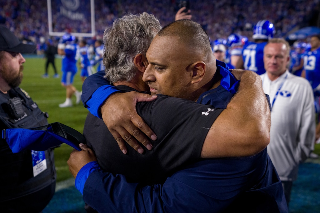 (Trent Nelson  |  The Salt Lake Tribune) Utah Utes head coach Kyle Whittingham and BYU Cougars head coach Kalani Sitake after the game, NCAA football at LaVell Edwards Stadium in Provo on Saturday, Oct. 18, 2025.