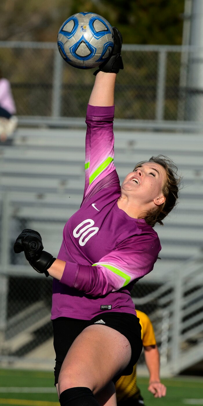 (Steve Griffin | The Salt Lake Tribune) East goal keeper Katie Liljenquest stretches for a save during the 5A semifinal girl's soccer match against Maple Mountain at Juan Diego High School in Draper Tuesday October 17, 2017.