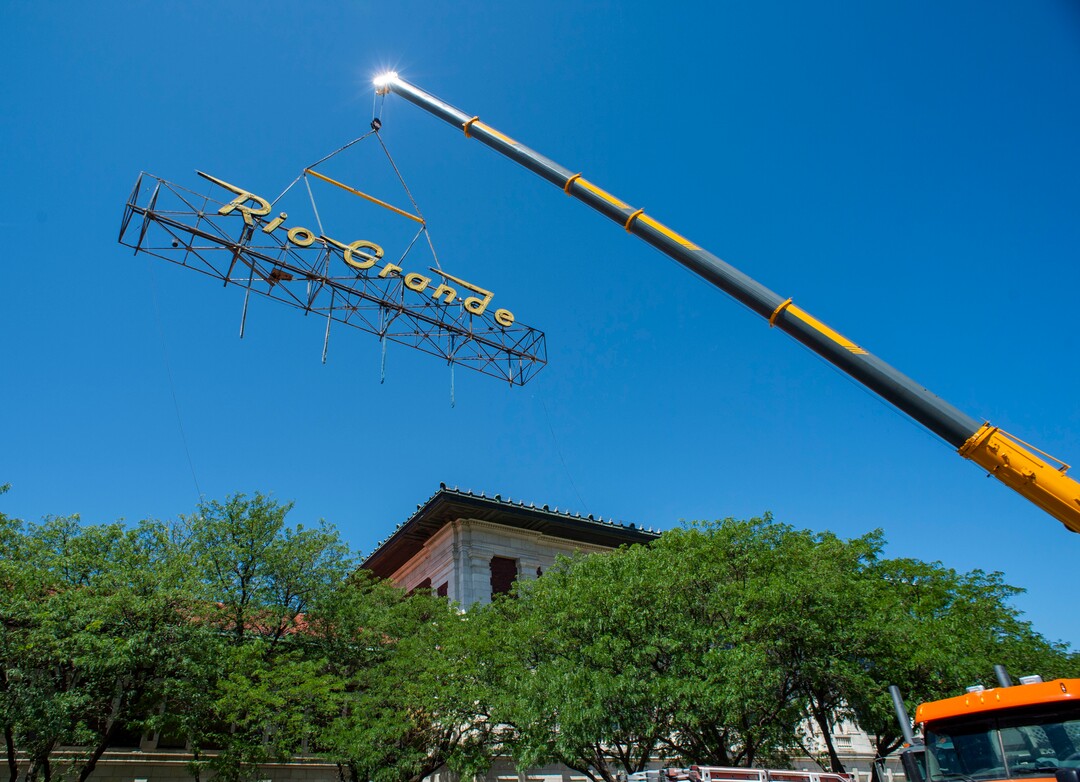 (Rick Egan  |  The Salt Lake Tribune)     The  neon Rio Grande sign that has shined from the rooftop of the Rio Grande Depot for more than 50 years is removed from the building, Monday, Aug. 12, 2019.