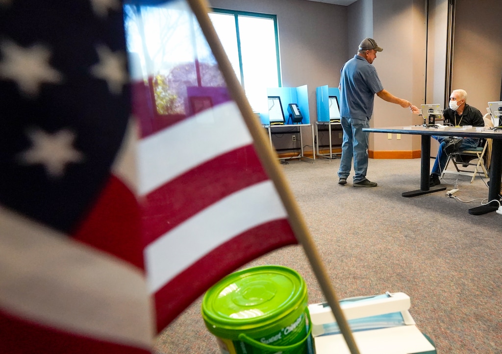 (Leah Hogsten | The Salt Lake Tribune) William Proger, left, gets ready to cast his ballot Nov. 2, 2021, at Sandy City Hall.