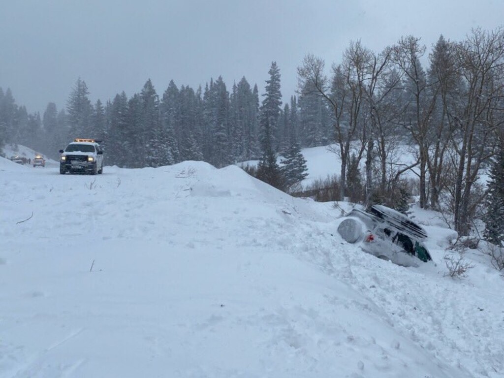 (Photo courtesy of the Utah Department of Transportation) A naturally occurring avalanche covered the road up Little Cottonwood Canyon on Sunday, Jan. 12, 2020. It hit a car, but did not injure any of the five passengers.