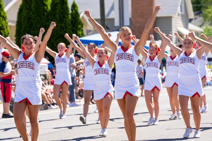 (Rick Egan | The Salt Lake Tribune)  The Weber High cheer leaders march in the Cherry Days Fourth of July parade, in North Ogden, on Monday, July 4, 2022.