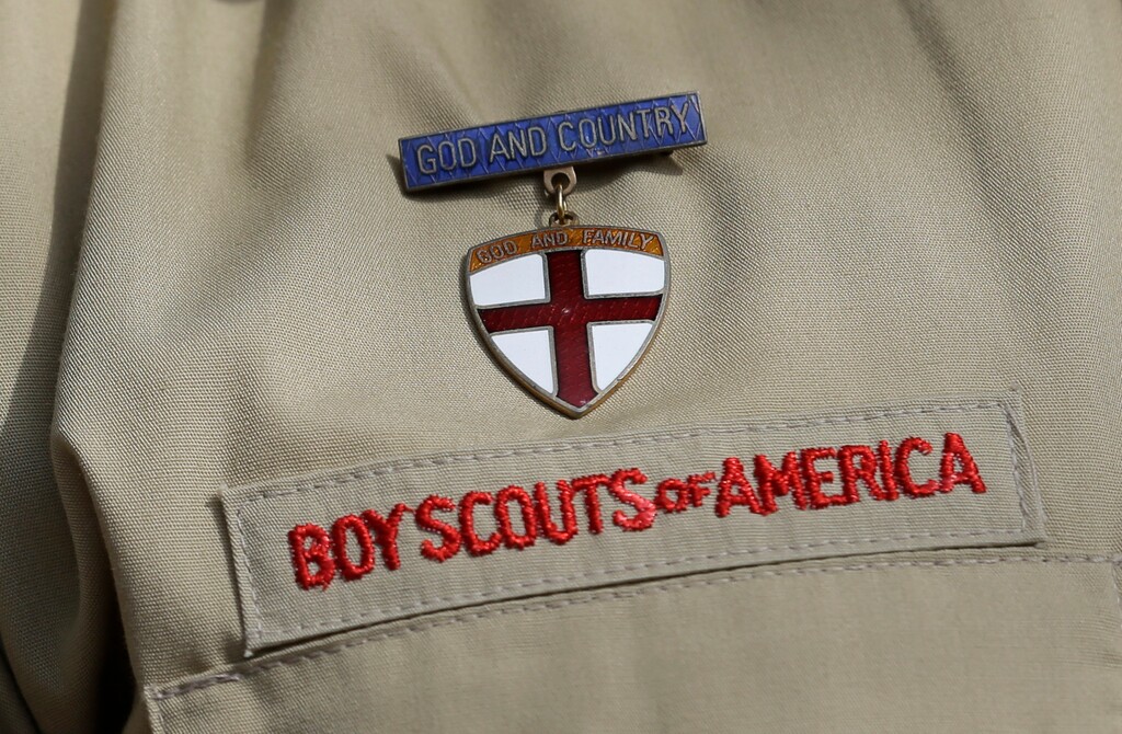 (Tony Gutierrez | The Associated Press) In this Feb. 4, 2013 file photo, shows a close up detail of a Boy Scout uniform worn during a news conference in front of the Boy Scouts of America headquarters in Irving, Texas. The Boy Scouts of America says it is exploring "all options" to address serious financial challenges, but is declining to confirm or deny a report that it may seek bankruptcy protection in the face of declining membership and sex-abuse litigation. "I want to assure you that our daily mission will continue and that there are no imminent actions or immediate decisions expected," Chief Scout Executive Mike Surbaugh said in a statement issued Wednesday, Dec. 12, 2018.