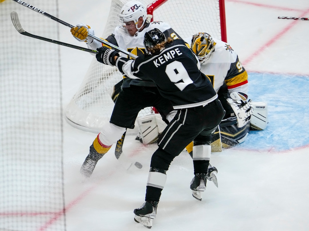 (Leah Hogsten | The Salt Lake Tribune) Vegas Golden Knights defenseman Zach Whitecloud (2) is shoved into the net by Los Angeles Kings right wing Adrian Kempe (9) as the Los Angeles Kings and Vegas Knights meet in a preseason game at Vivint Arena on Sept. 30, 2021.