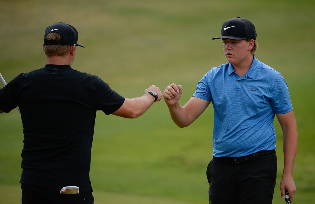 (Francisco Kjolseth  |  The Salt Lake Tribune)  Preston Summerhays, 16, fist bumps with his father Boyd as he competes in the State Amateur golf champion at Soldier Hollow Golf Course on Saturday, July 13, 2019, beating Chase Lansford 7 and 6 in the final championship match.