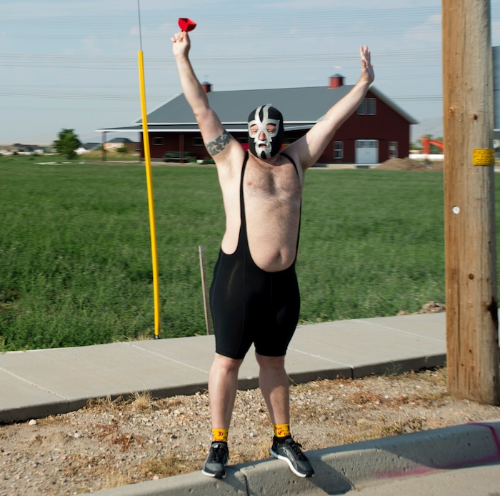 (Rick Egan  |  The Salt Lake Tribune)  A wrestler shows up to cheer on the riders in Layton, in the Tour of Utah Stage 5, Friday, August 4, 2017.


