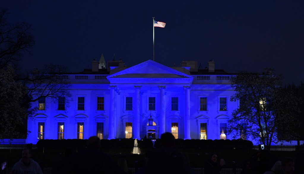 The White House in Washington is lit in blue Monday, April 2, 2018, in honor of World Autism Awareness Day. (AP Photo/Susan Walsh)