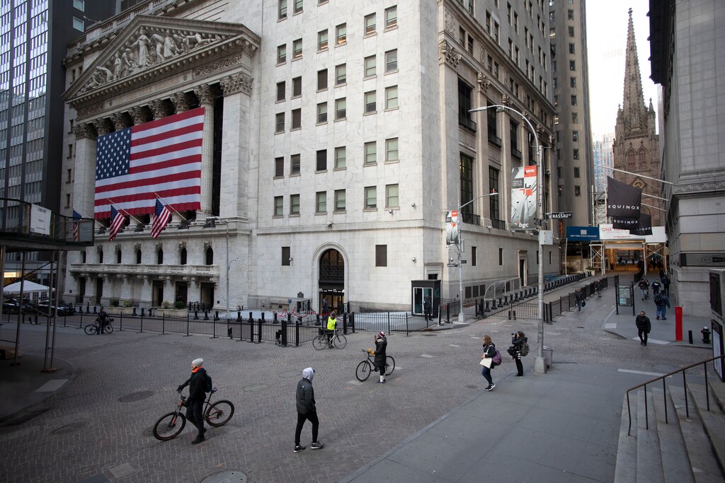 (Mark Lennihan | AP photo)

In this March 18 photo, a few people walk on Wall Street in front of the New York Stock Exchange in New York.
