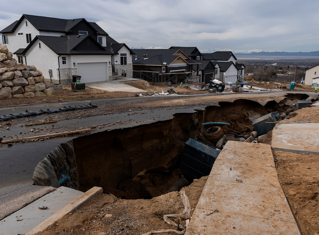 (Rick Egan | The Salt Lake Tribune) Flooding led to collapsed pavement on Orchard Ridge Lane in Kaysville, on Wednesday, April 12, 2023.